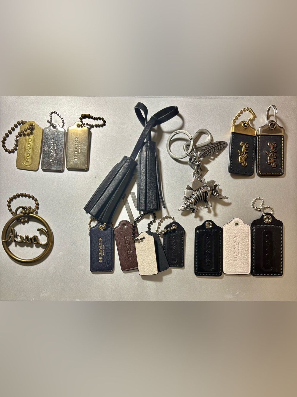 Coach women’s Key Tag Set in White, Black and Gold